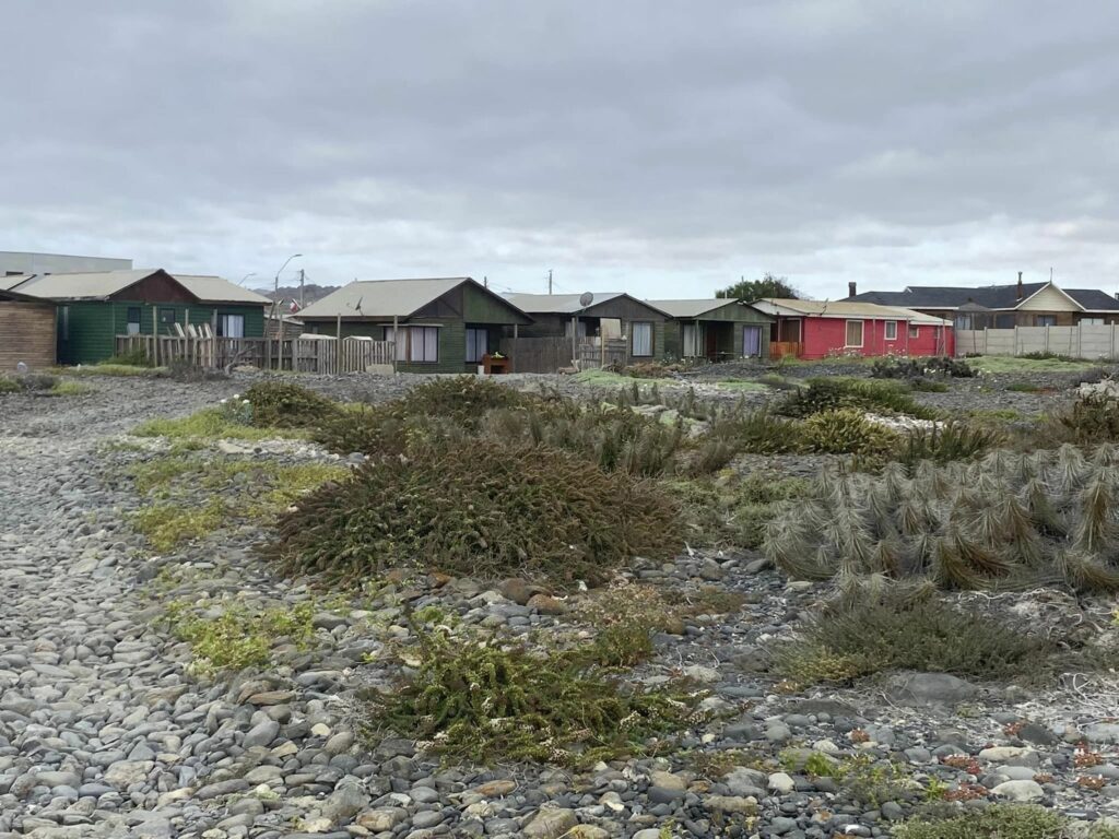 small bungalow houses on rocky land