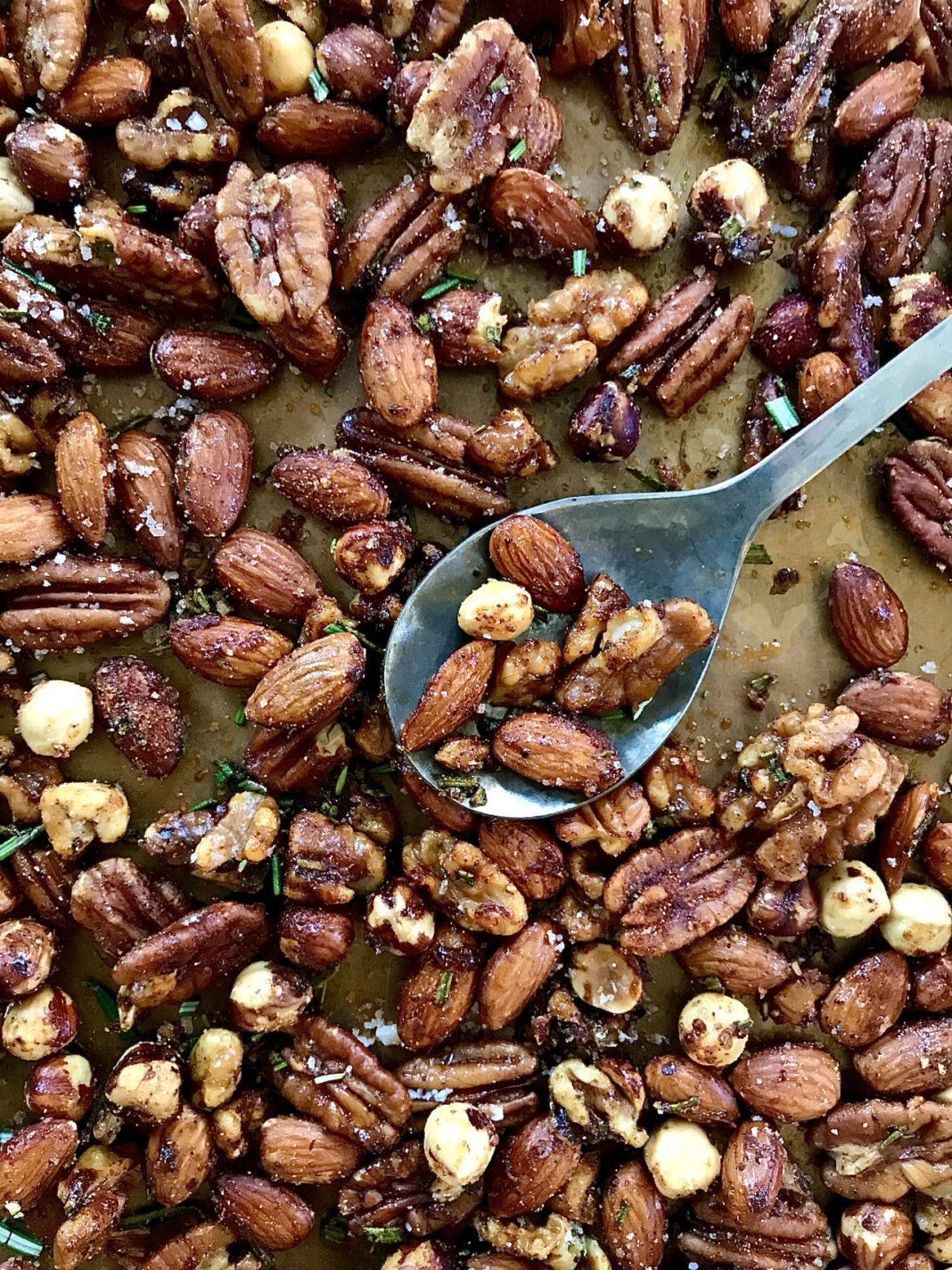 mixed roasted nuts on baking sheet